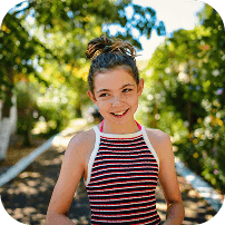 Young girl outdoors smiling